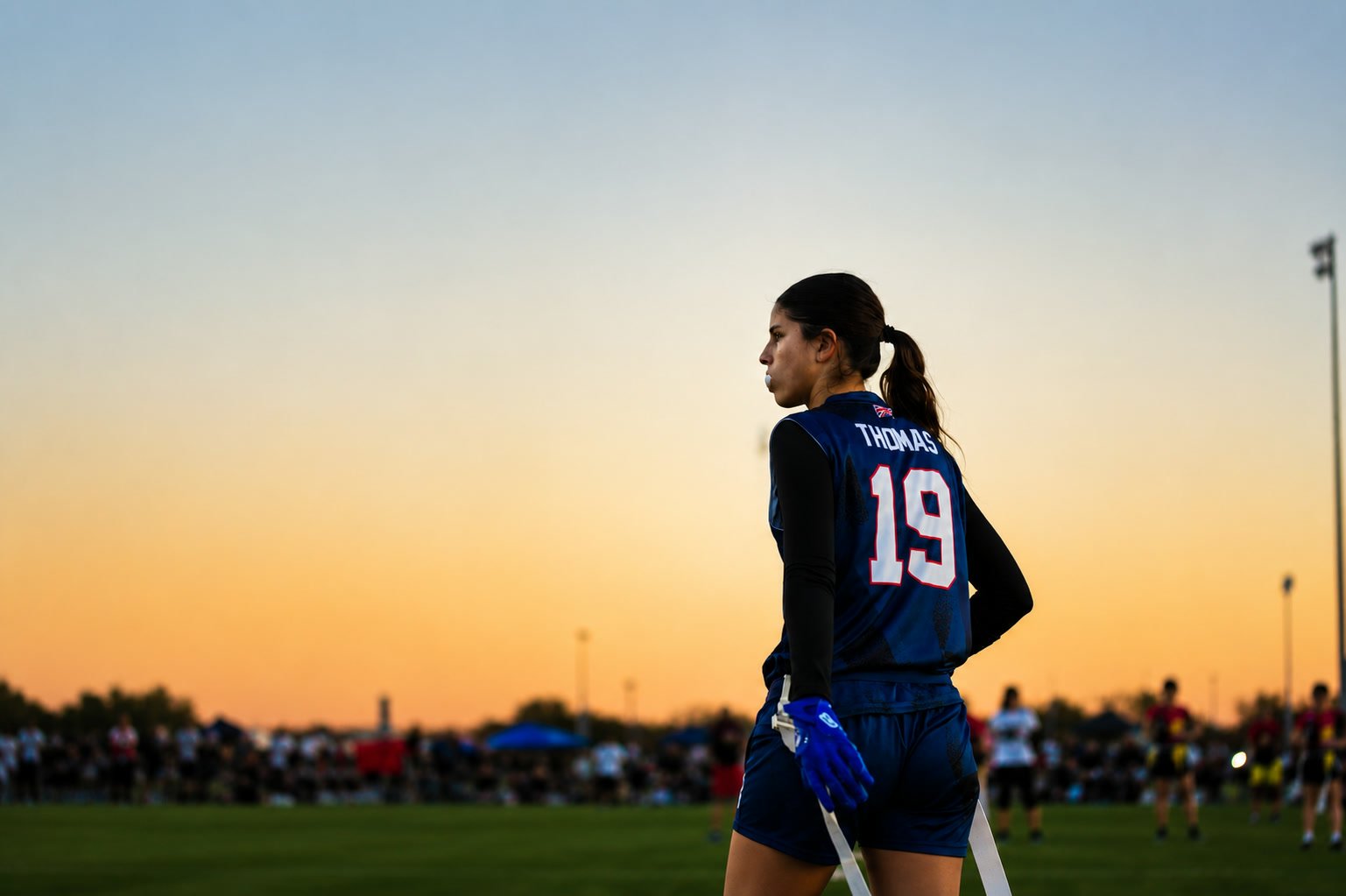 Kayleigh Thomas in her Great Britain flag football jersey at sunset